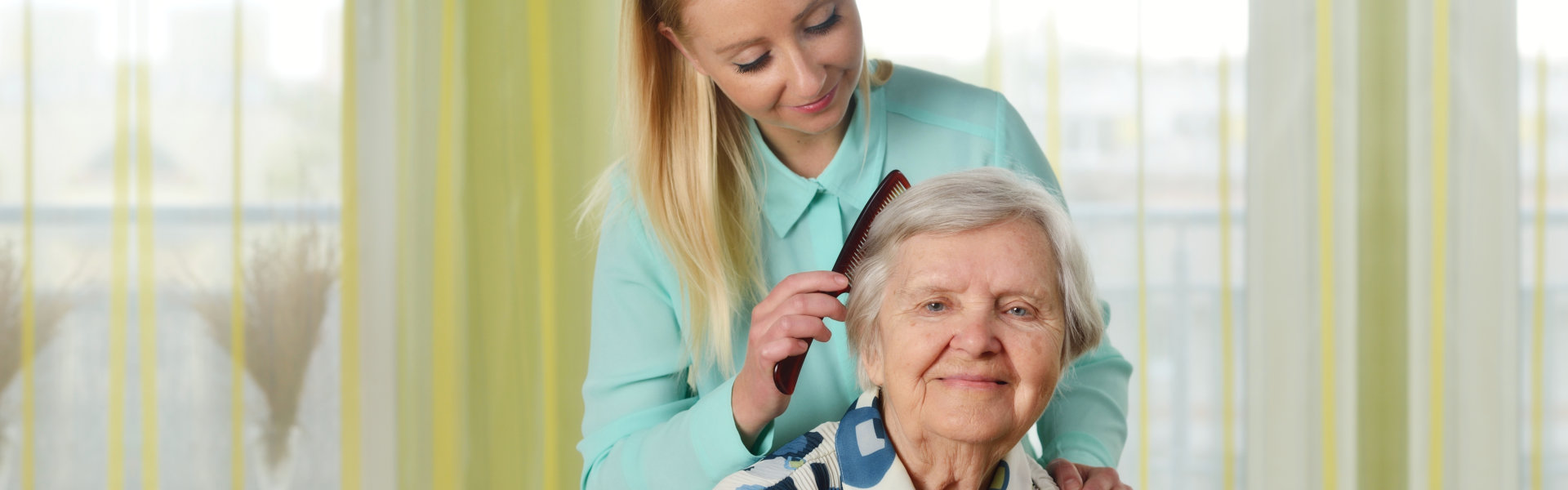 nurse combing her patient