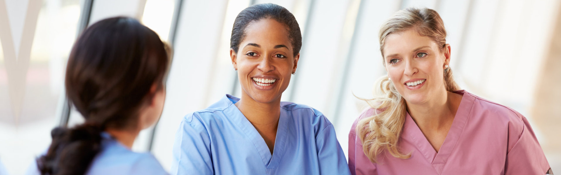 three nurses having a conversation